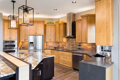 Beautiful Kitchen in Luxury Home with Island and Stainless Steel